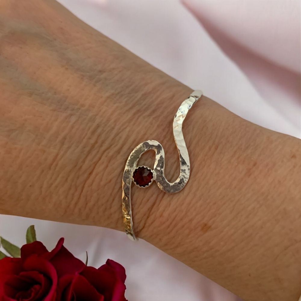 Elegant Sterling Silver Wave Bracelet with Red Garnet Gemstone
